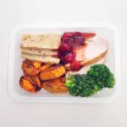 In a tray, lean and tender breast of turkey, oven roasted with extra moisture, served with homemade sage & bacon stuffing, roasted carrots & pumpkin, steamed broccoli, and with our own delicious cranberry sauce.