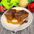 Rich sticky date pudding, served warm with a silky butterscotch sauce that cascades over each slice, creating the perfect comforting classic dessert.